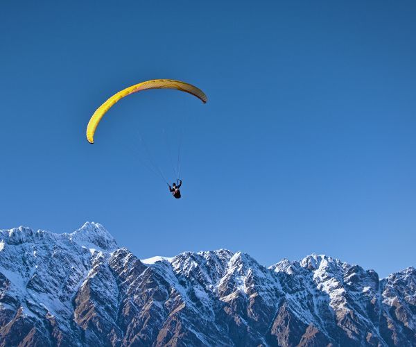 A man paragliding in Queenstown